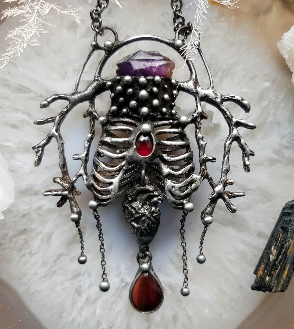 Human heart in the branches of the forest