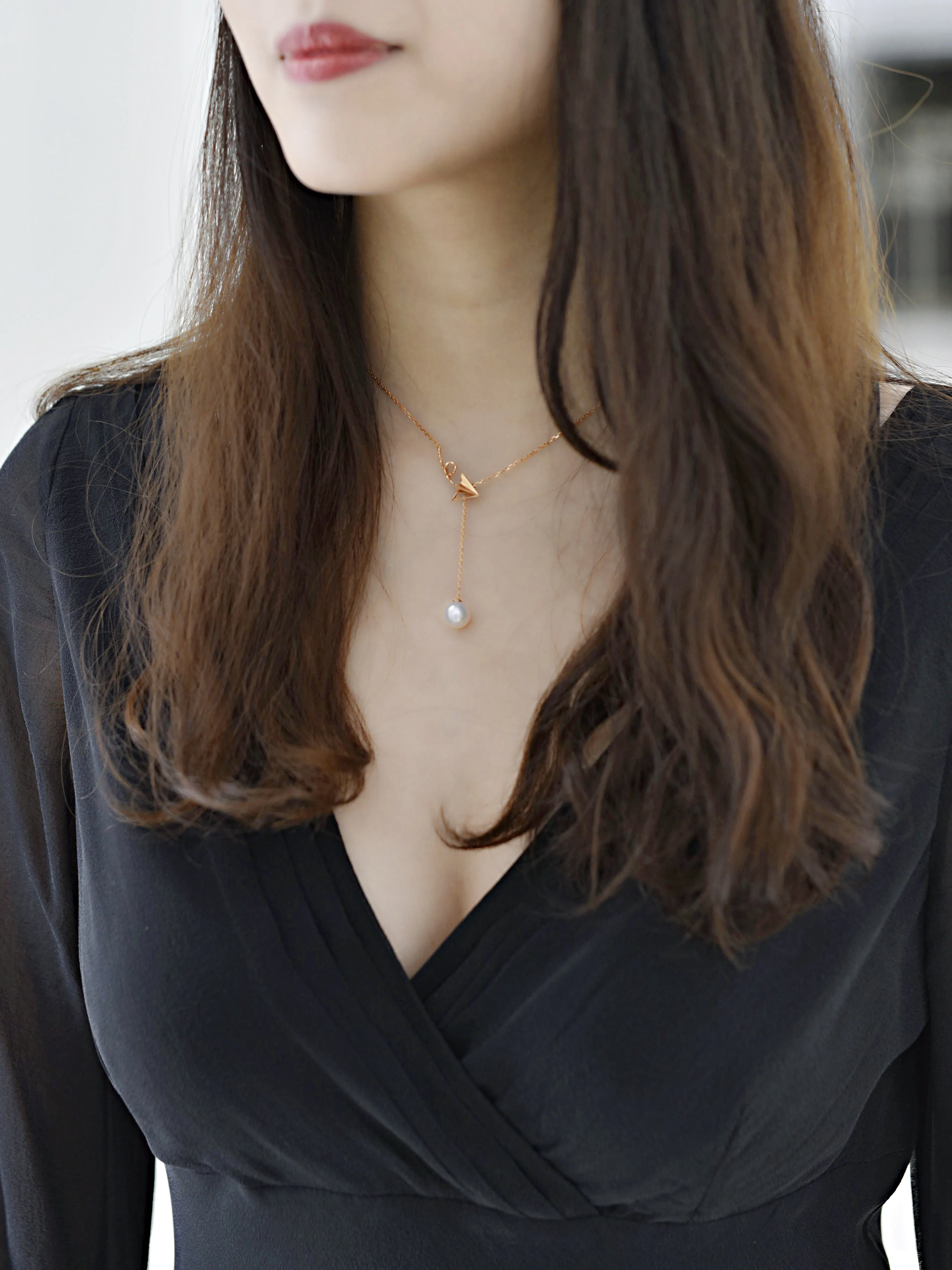 “Origaminx Airplane” 18K gold and Akoya pearl, origami-shaped necklace