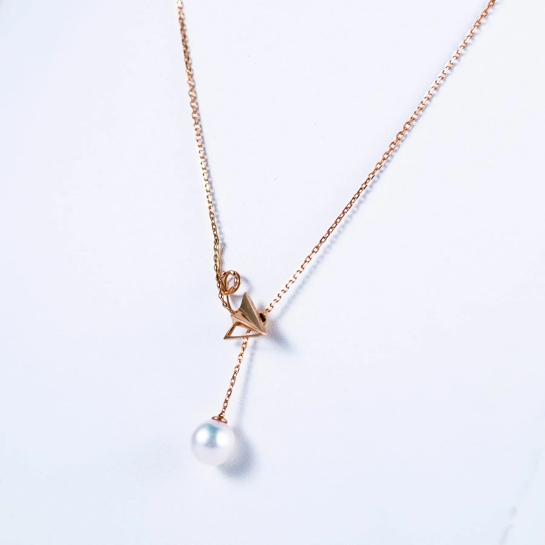 “Origaminx Airplane” 18K gold and Akoya pearl, origami-shaped necklace