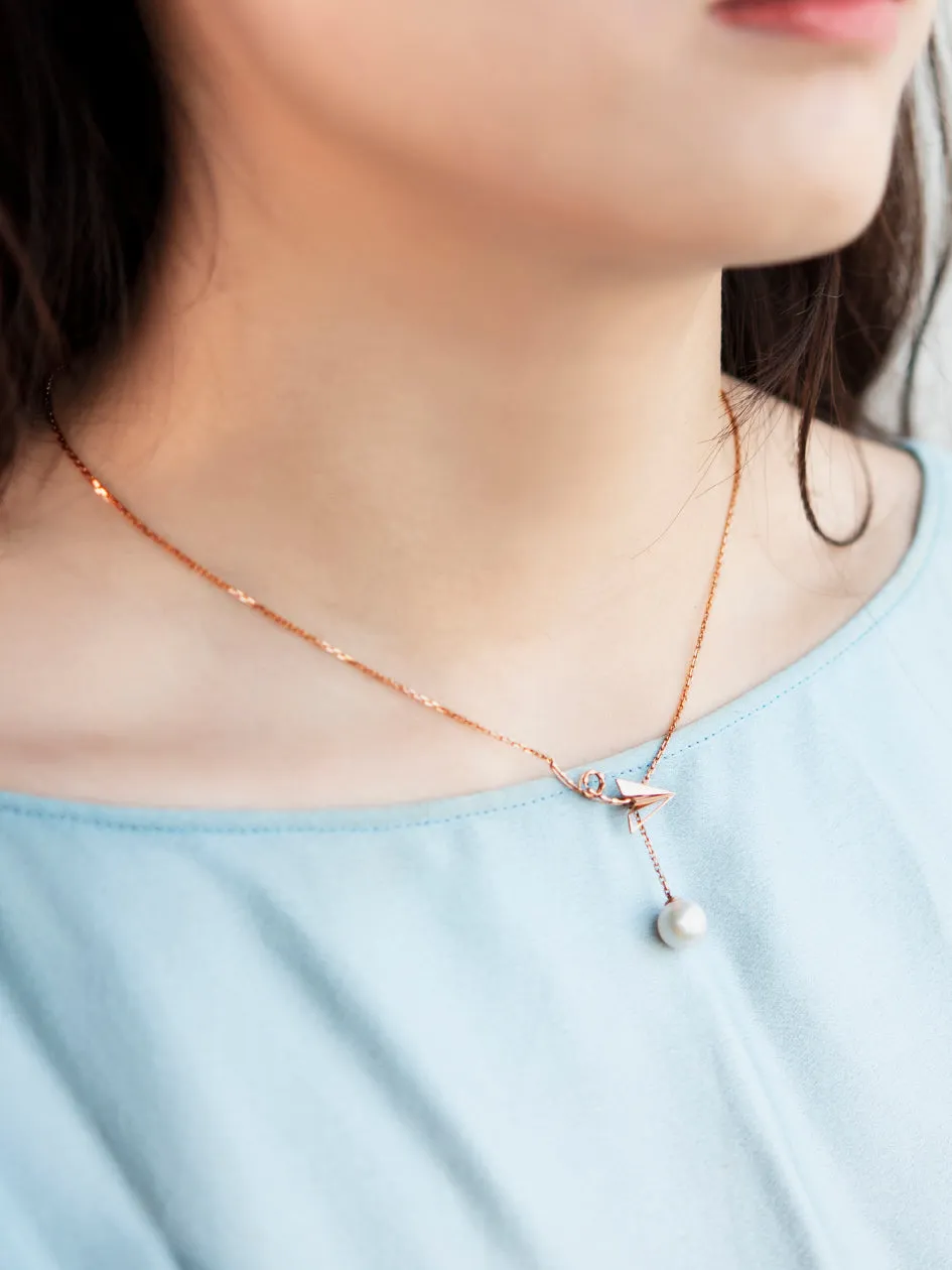 “Origaminx Airplane” 18K gold and Akoya pearl, origami-shaped necklace