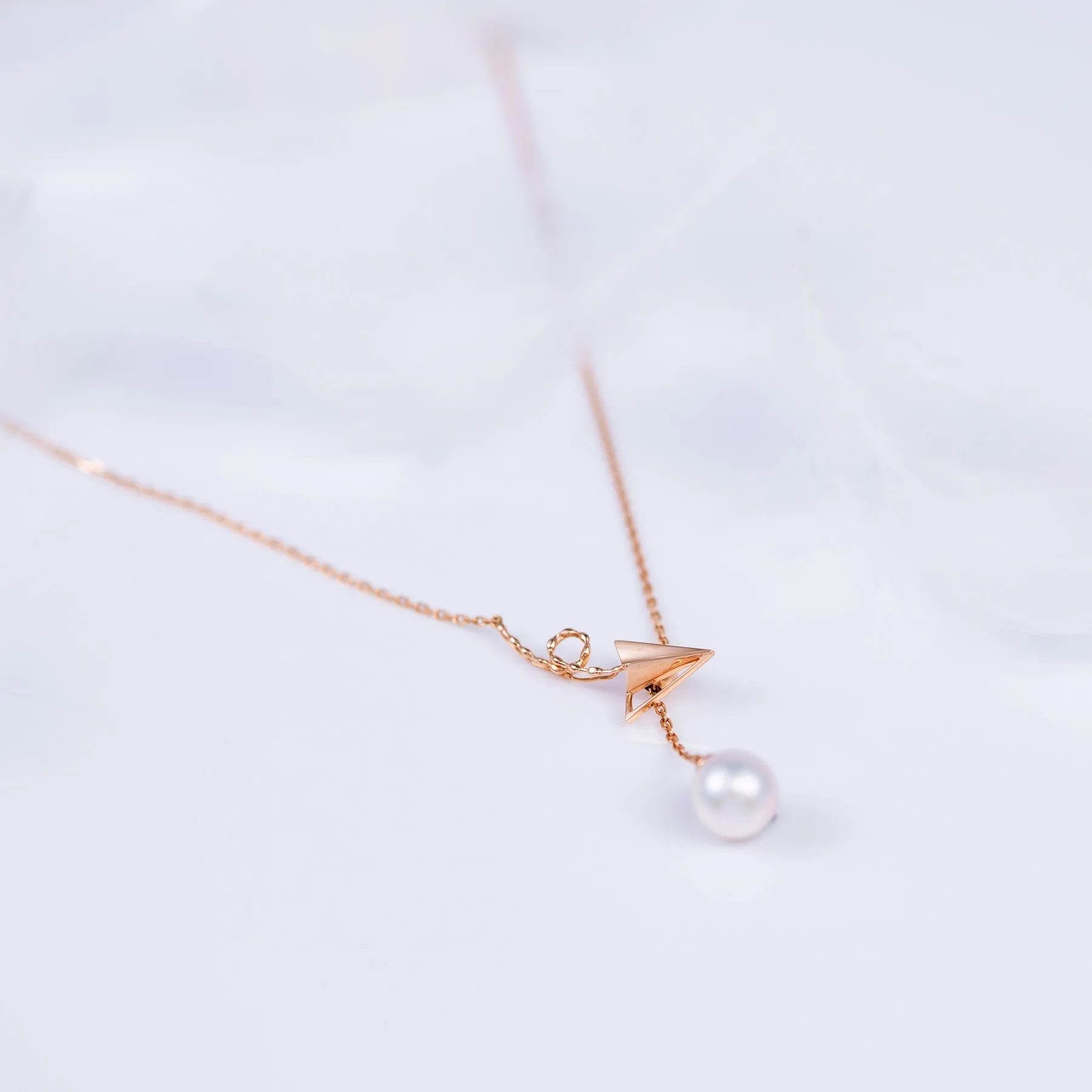“Origaminx Airplane” 18K gold and Akoya pearl, origami-shaped necklace